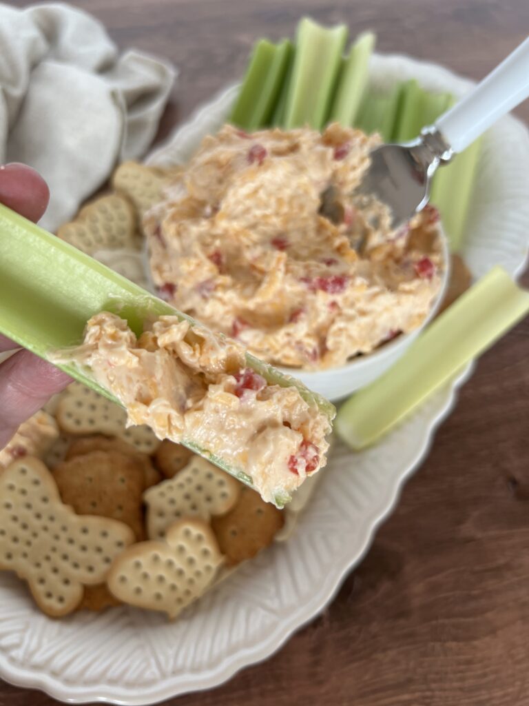 pimento cheese on a celery stick. recipe by Jill Bauer