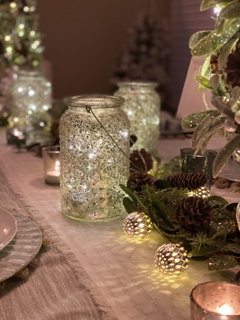 silver mercury glass mason jars on a pretty holiday dining table