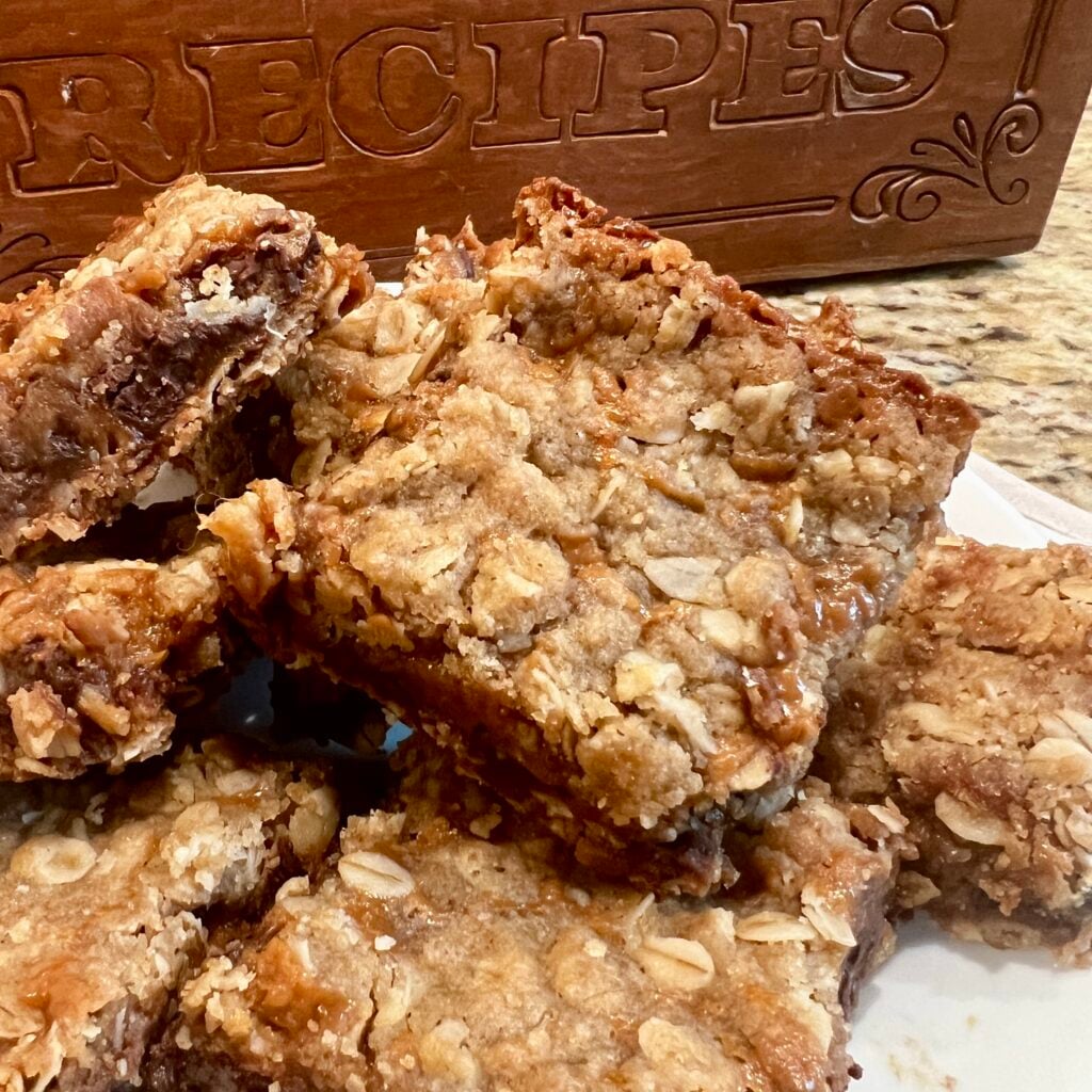 close up of oat chocolate and caramel bars by jill bauer